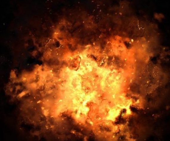 Realistic fiery explosion busting over a black background.